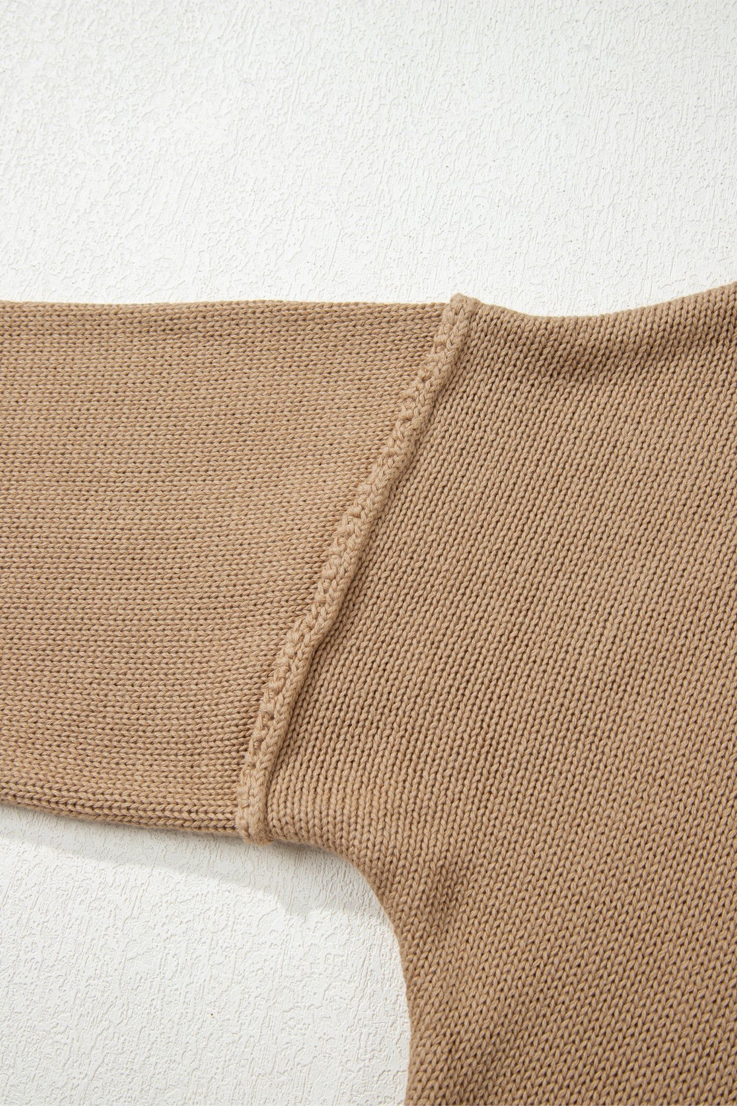 Close-up of a Khaki Oversized Jumper Dress on a light background