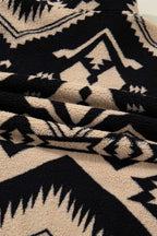 Detailed view of sherpa fleece fabric on Women's Black Plus Size Aztec Print Plush Sweatshirt, showcasing soft texture and bold print.