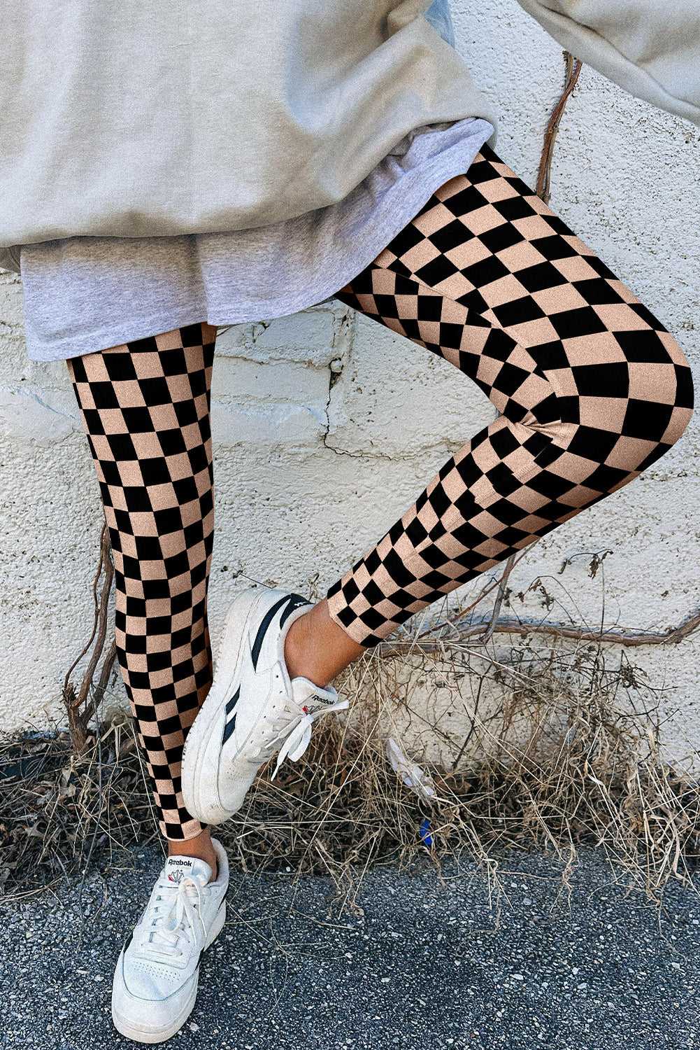 Black and beige Checkered Pattern Skinny Leggings paired with oversized sweatshirt, ideal for casual spring outfits.