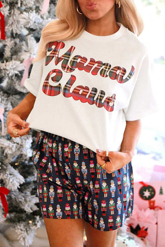 Ladies Nutcracker Christmas Lounge Set by FashionFitz UK featuring a white 'Mama Claus' t-shirt and navy nutcracker print shorts, perfect for festive lounging.
