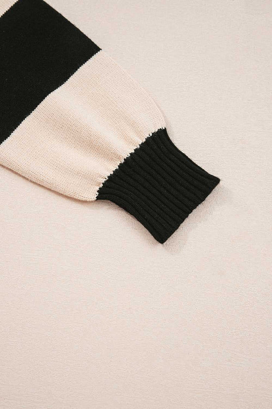 Sleeve detail of Monochrome Knit Dress - Cozy & Stylish | FashionFitz featuring ribbed cuff and soft knit fabric in black and beige.