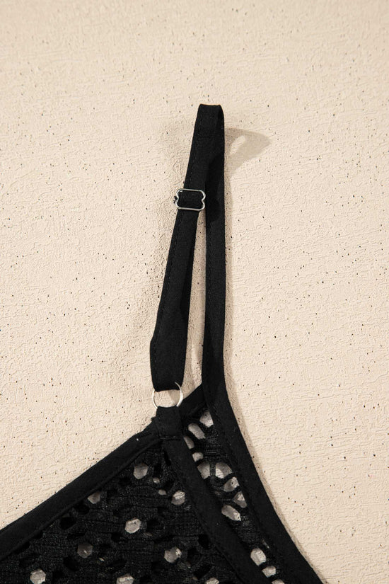 Close-up of strap detail on black crochet beach cover-up