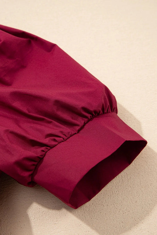 Burgundy puff sleeve blouse styled with wide-leg trousers and sandals | Fashionfitz