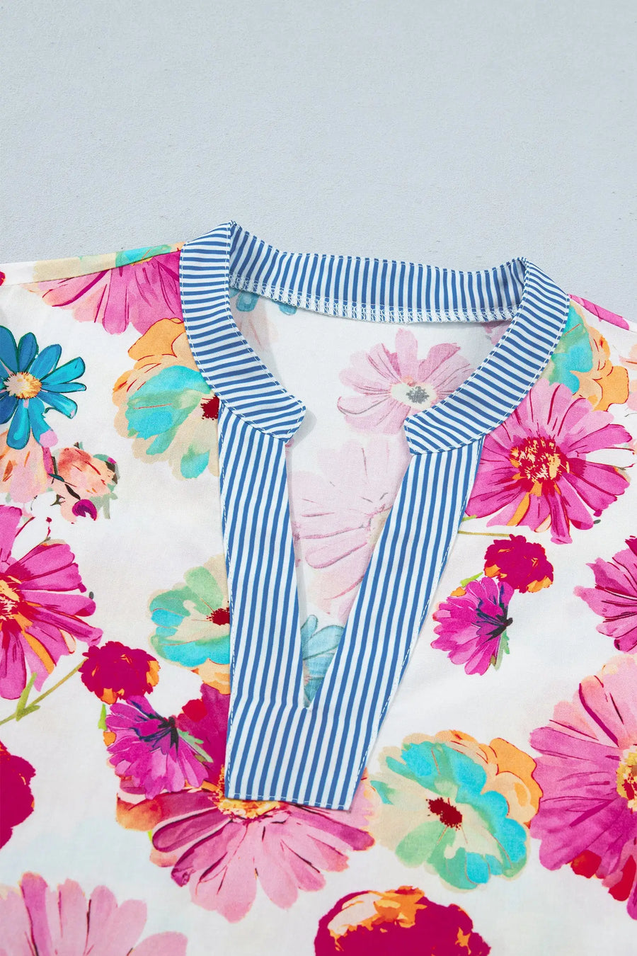 V-neck floral blouse with puff sleeves — back view, lightweight summer fabric