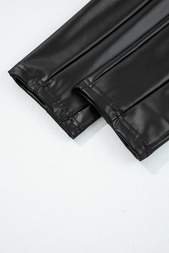 Detailed view of ankle hem stitching on Black Vegan Leather Leggings – High‑Rise Skinny Fit, showcasing durable finish and sleek cut.