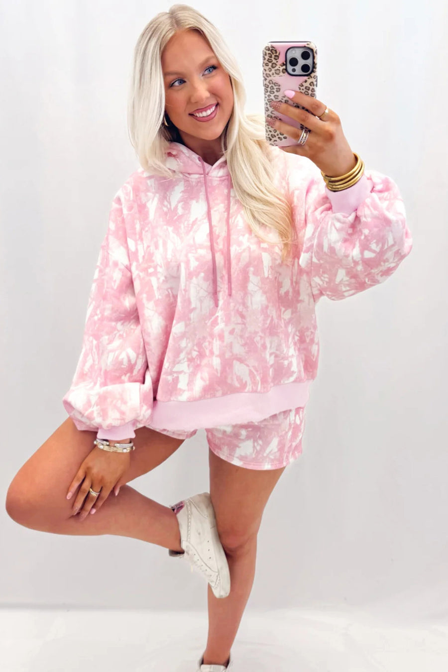 Abstract print hoodie and slim shorts set — close-up of hoodie hood and sleeve detail
