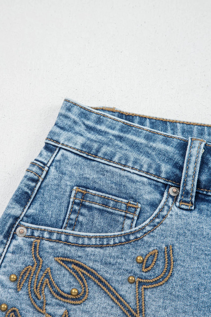 Women's western stud denim shorts flat lay casual