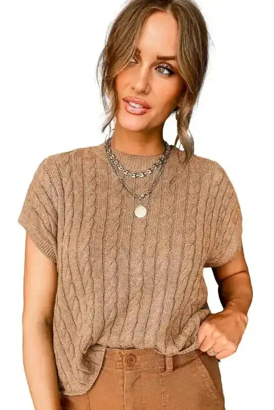 Beige Cable Knit Short Sleeve Sweater on white background, highlighting its soft texture and classic crew neck design.