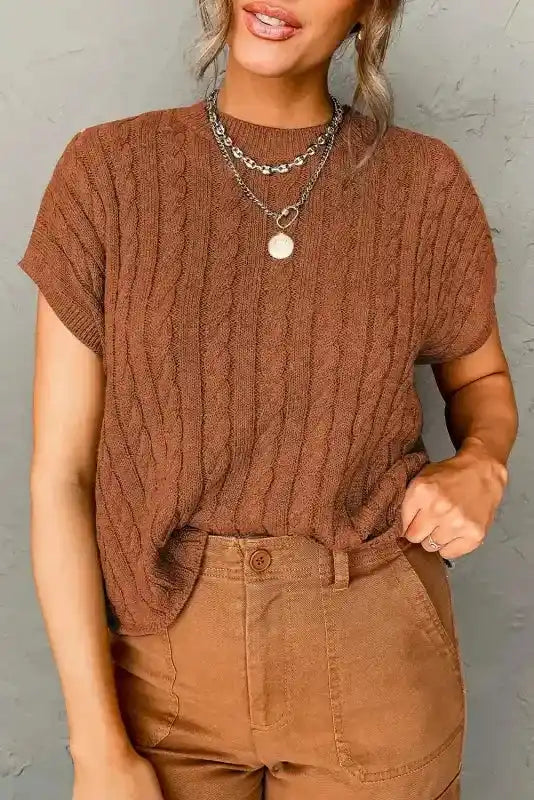 Rust brown Cable Knit Sweater - Short Sleeve Style with ribbed crew neck, styled with matching brown pants for a warm-toned outfit.