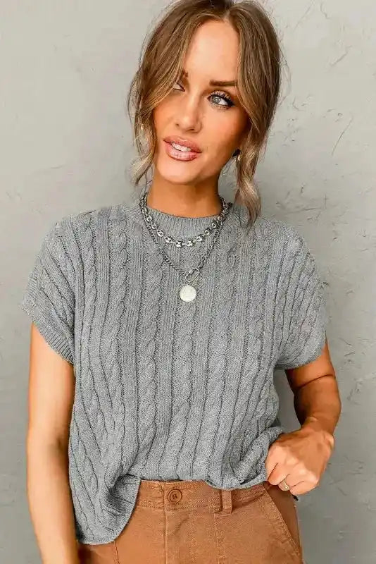 Front view of gray Cable Knit Sweater - Short Sleeve Style paired with high-rise pants, ideal for office or everyday wear.