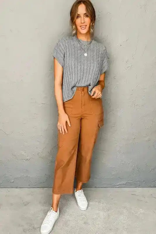 Full outfit with gray Cable Knit Short Sleeve Sweater, brown cropped pants, and white sneakers for a chic transitional look.