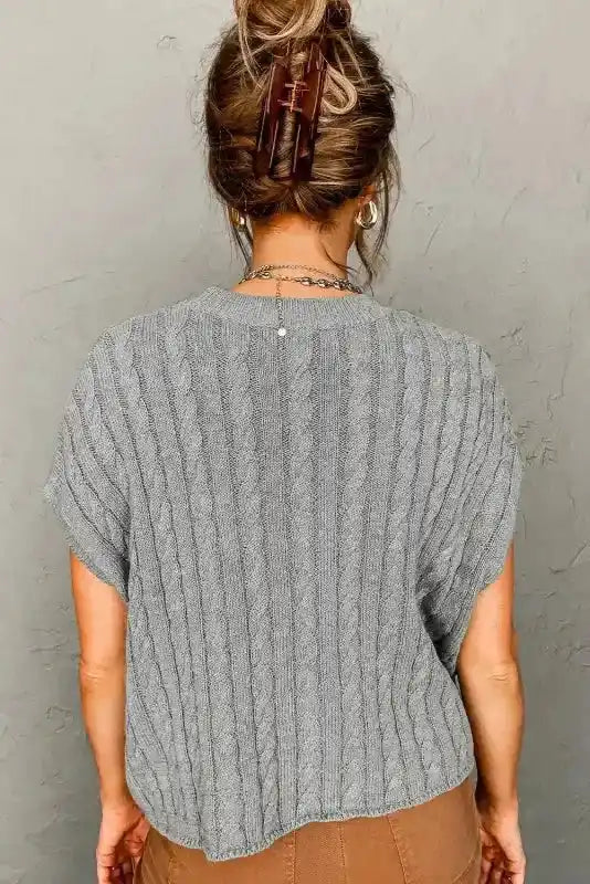 Back view of gray Cable Knit Short Sleeve Sweater showing vertical cable pattern and relaxed silhouette, perfect for daily wear.