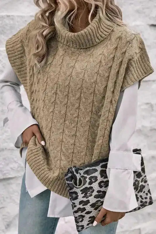 Beige cable knit turtleneck short sleeve jumper paired with leopard print clutch. A stylish knitwear top for daily and occasion wear.