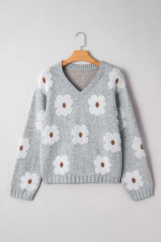Front view of FashionFitz Oversized Grey Floral Knit Jumper – V‑Neck with white daisy pattern and ribbed hem, ideal for fall layering.
