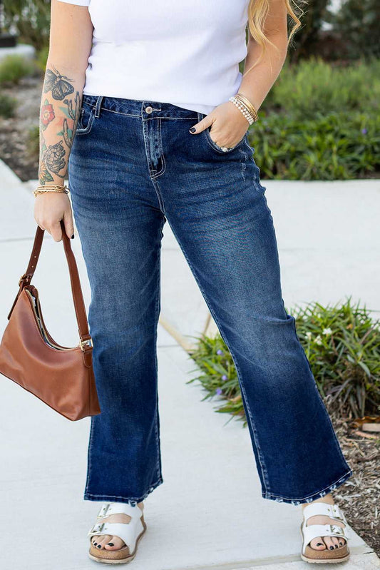 Front view of Dirty Blue Side‑Slit Flare Jeans – Curve styled with white top and sandals, highlighting flattering fit and solid blue wash.