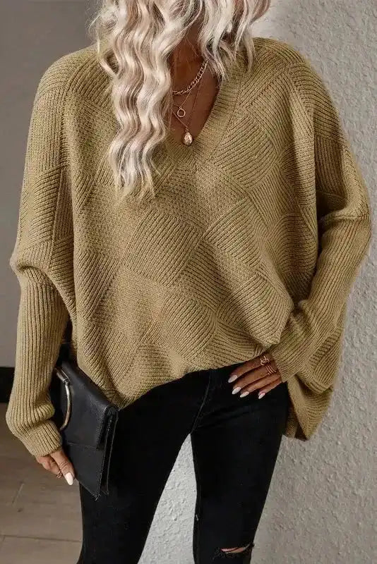 FashionFitz Camel Checkered Textured Batwing Sleeve Sweater styled with black jeans and layered necklaces for a chic outfit.