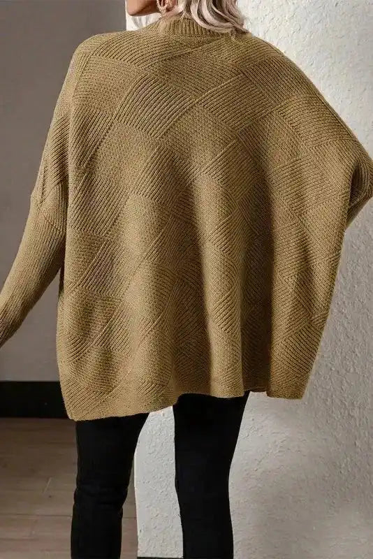 Back view of Camel Batwing Sleeve Sweater showing oversized fit and diamond checkered knit texture for casual winter wear.