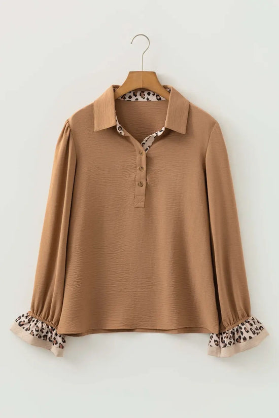 Flat lay of Camel Leopard Fusion Polo Blouse showing full design with leopard print collar and ruffle sleeve cuffs for a bold casual style.