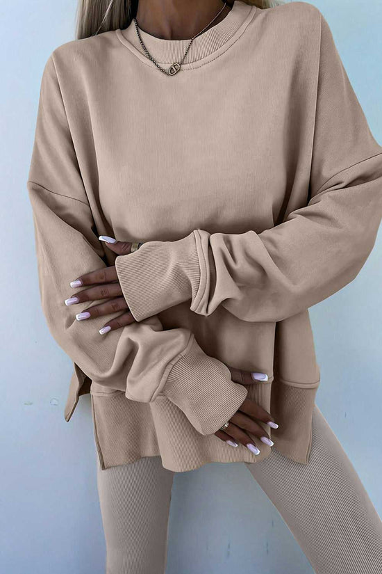 Close-up of beige Oversized Sweatshirt and Leggings Matching Set, highlighting the soft fabric and oversized sleeves for a comfy lounge look.