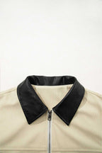 Beige jacket with black collar on a white background
