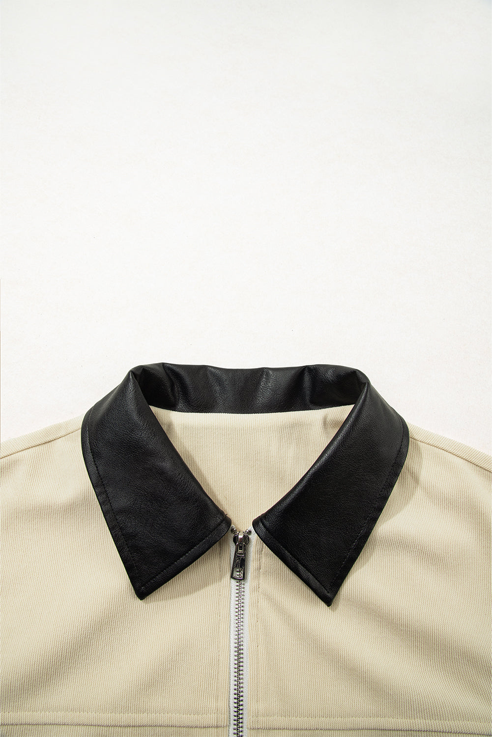 Beige jacket with black collar on a white background