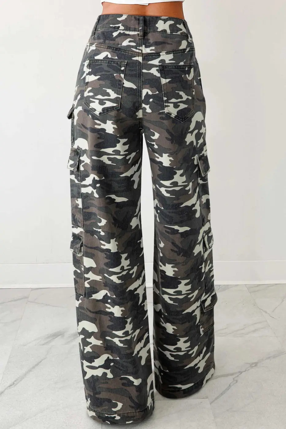 Camo cargo jeans women in green camo print with wide leg fit and utility pockets, shown from the back. High-waist denim pants for casual wear.