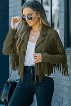 Fashionable green cropped fringe faux suede jacket with layered necklaces and sunglasses, ideal for autumn street style.