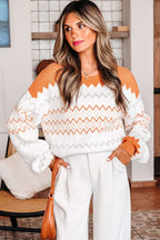 Woman wearing a Zigzag Cozy Knit Jumper with white pants indoors.