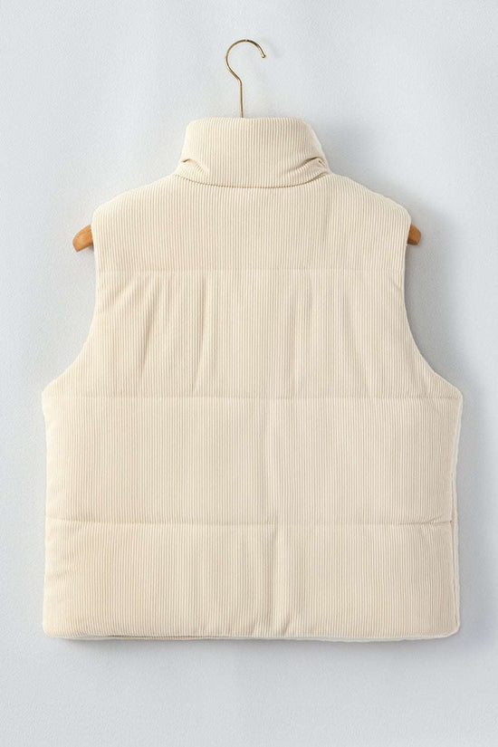 Back of ladies beige corduroy puffer gilet on hanger, featuring clean lines and padded winter vest design.