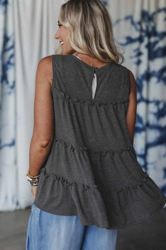 Back view of dark grey tiered frill tank top for women with keyhole button closure and soft ruffle detailing.