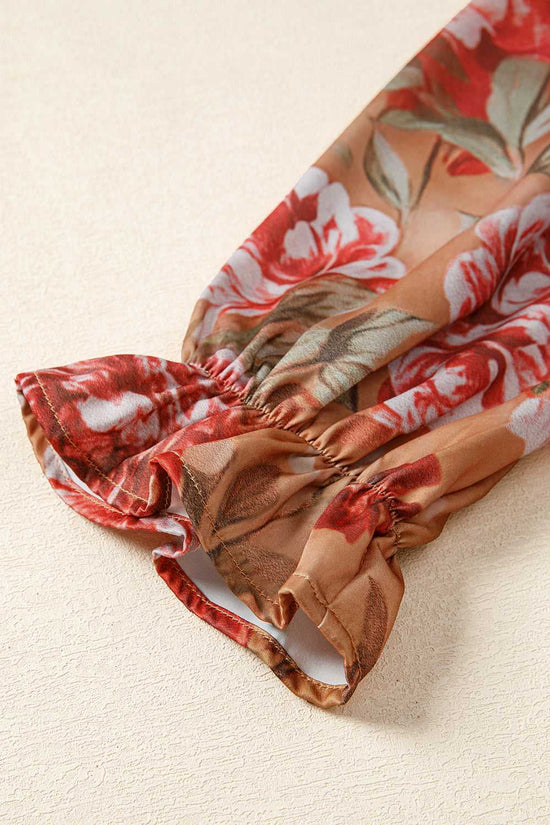 Detailed view of Retro Floral Ruffle Mini Dress sleeve with elastic cuff and ruffle trim, showcasing floral design and stitching.