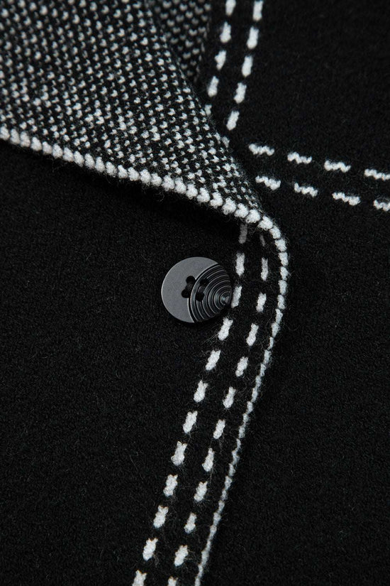 Close-up of button and inner lining on Women's Black Contrast Trim Knitted Cardigan, emphasizing quality stitching and craftsmanship.