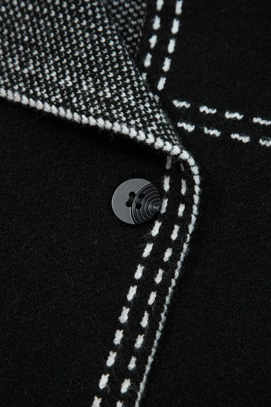 Close-up of button and inner lining on Women's Black Contrast Trim Knitted Cardigan, emphasizing quality stitching and craftsmanship.