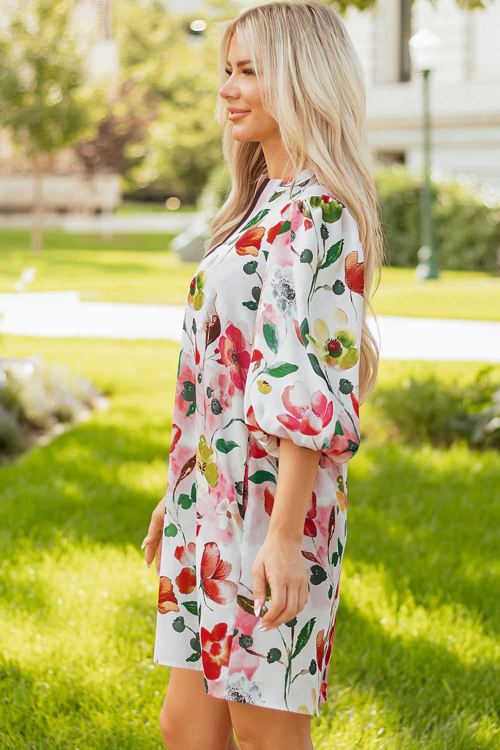 Side profile of model in Floral Shift Dress - Casual Elegance, displaying puff sleeves and flattering H-line silhouette for daily wear.