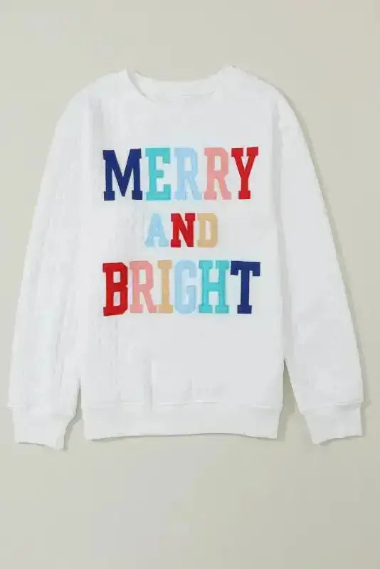 White Chenille Embroidered Sweatshirt from Graphic Collection FashionFitz with colorful 'MERRY AND BRIGHT' text, laid flat.