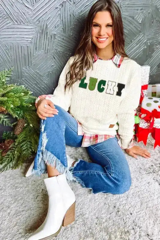 Women's Chenille Embroidered Sweatshirt with 'LUCKY' slogan, cozy knit texture, styled with jeans and boots for autumn fashion.