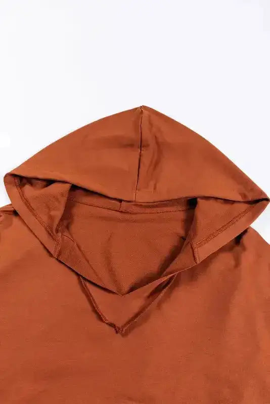 Close-up of chestnut hoodie’s V-neck hood design, highlighting textured cotton fabric and stitching details.
