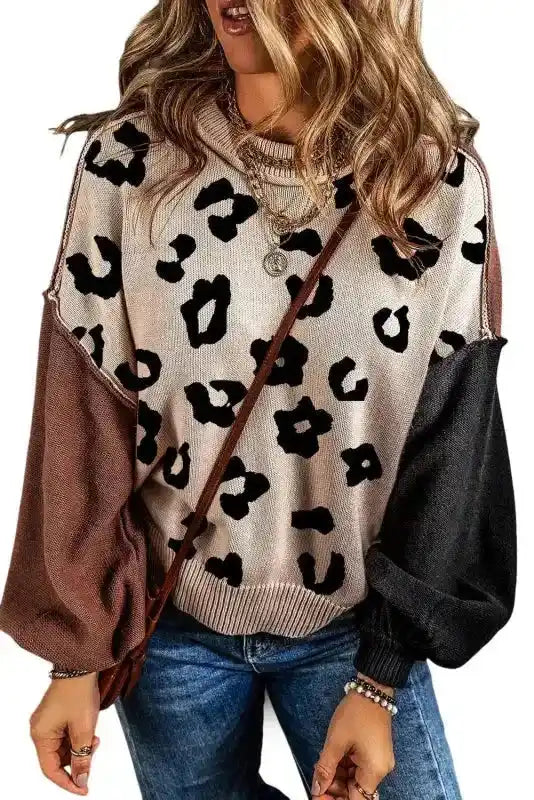 Front view of Coffee Leopard Print Colorblock Pullover Sweater featuring beige body, black leopard spots, and colorblock sleeves.