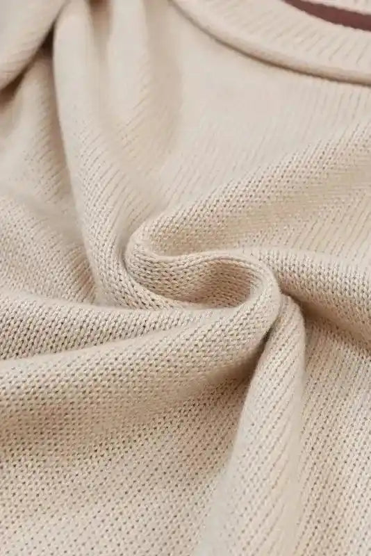 Fabric detail of Coffee Leopard Print Colorblock Pullover Sweater showing soft beige knit texture and stretchable material.
