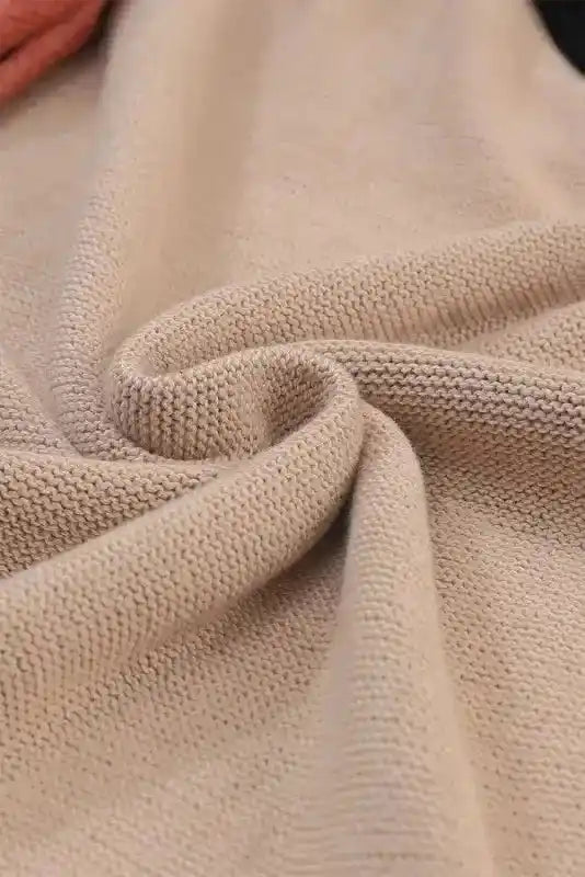 Close-up of beige knit fabric texture from Coffee Leopard Print Colorblock Pullover Sweater - New, showing soft and cozy material.
