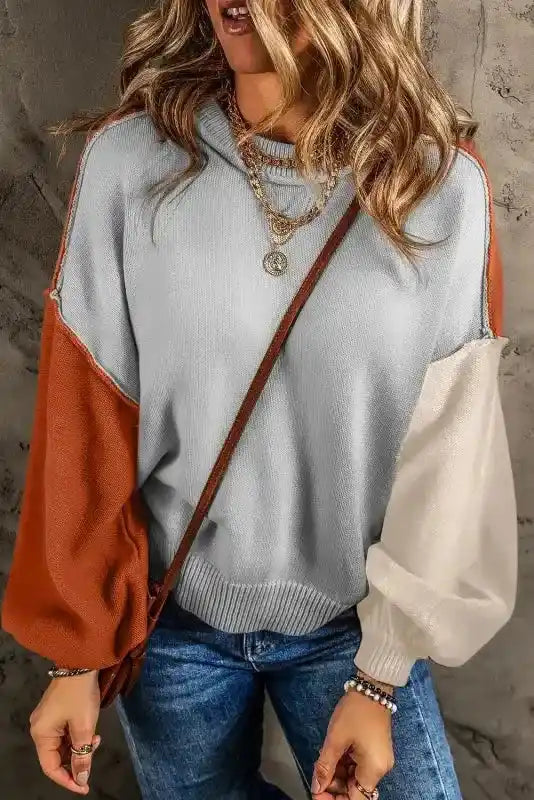 Front view of Coffee Leopard Print Colorblock Pullover Sweater - New in light gray, rust, and cream, styled with denim and crossbody bag.