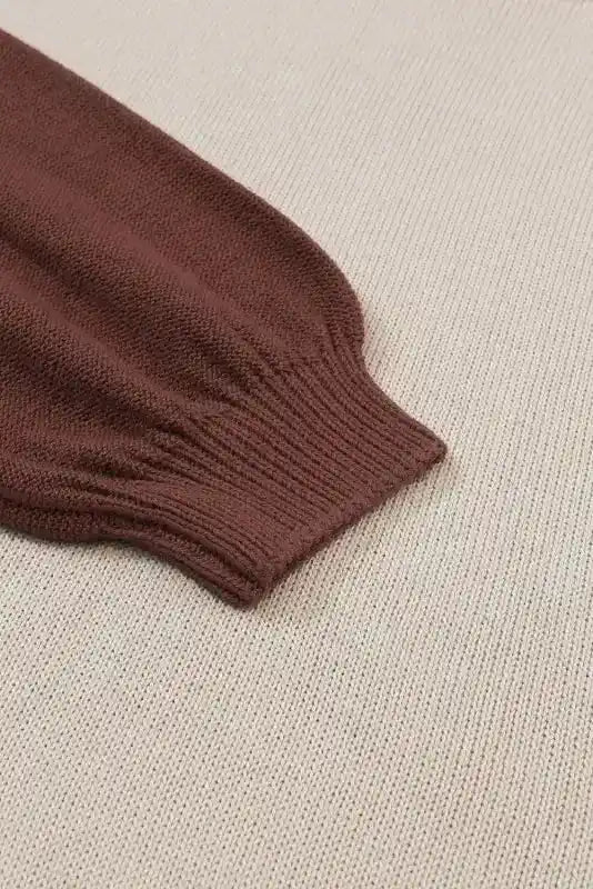 Detailed view of brown sleeve cuff on Coffee Leopard Print Colorblock Pullover Sweater with ribbed knit finish.