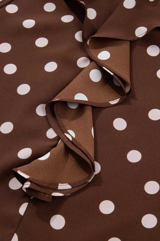 Zoomed-in view of the ruffled front design on the coffee polka dot chiffon blouse, highlighting the soft texture and elegant polka dot print.