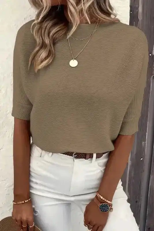 Coffee ribbed knit jumper for women with short sleeves, paired with white pants and accessories for a stylish daily outfit.