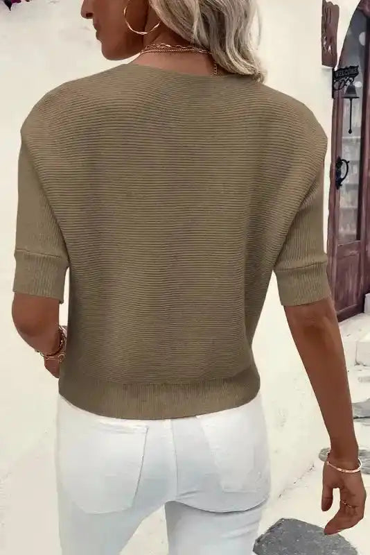 Back view of women’s coffee ribbed knit jumper with short sleeves, showcasing its relaxed fit and soft texture for everyday wear.