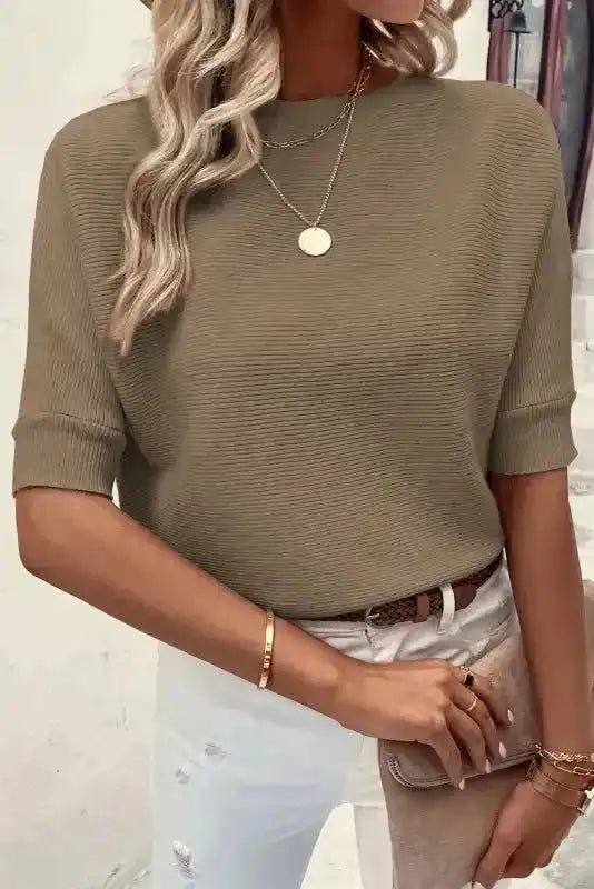 Coffee half sleeve ribbed knit jumper tucked into distressed white jeans, ideal for layering in autumn casual fashion.