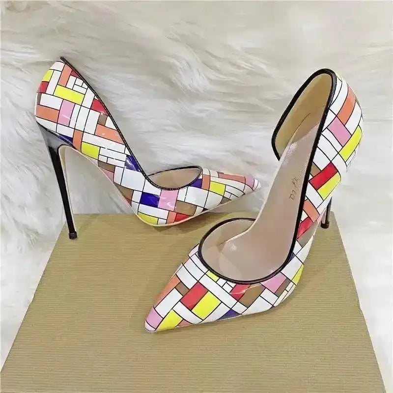 Prism Clash Chequered Court Heels displayed on a textured surface, showcasing pointed toe and vibrant multicolour pattern.