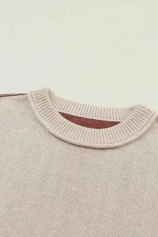 Close-up of ribbed neckline on Colorblock Bishop Sleeve Sweater - Women's Sweaters at FashionFitz showing beige and brown color contrast.