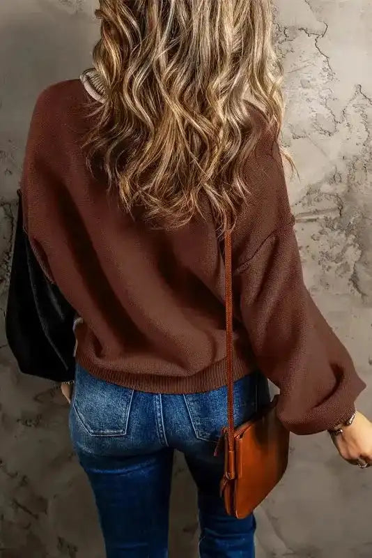 Back view of Colorblock Bishop Sleeve Sweater - Women's Sweaters at FashionFitz showing brown back panel and contrasting black sleeve.