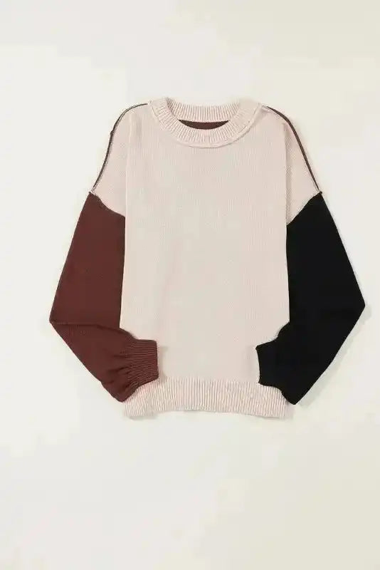 Flat lay of Colorblock Bishop Sleeve Sweater - Women's Sweaters at FashionFitz with beige front, brown left sleeve, and black right sleeve.